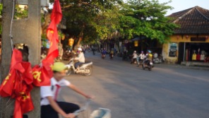 Central Hoi An, Vietnam traffic. Symbols of the past and present in motion.
