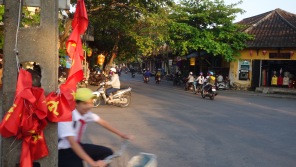 Central Hoi An, Vietnam traffic. Symbols of the past and present in motion.